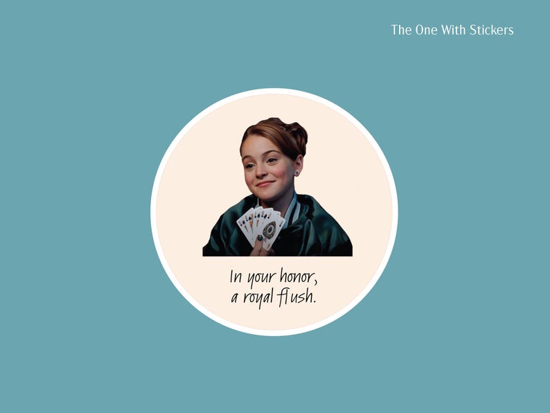 Circle sticker of Hallie Parker playing poker and holding up cards with caption that reads in your honor, a royal flush from The Parent Trap movie