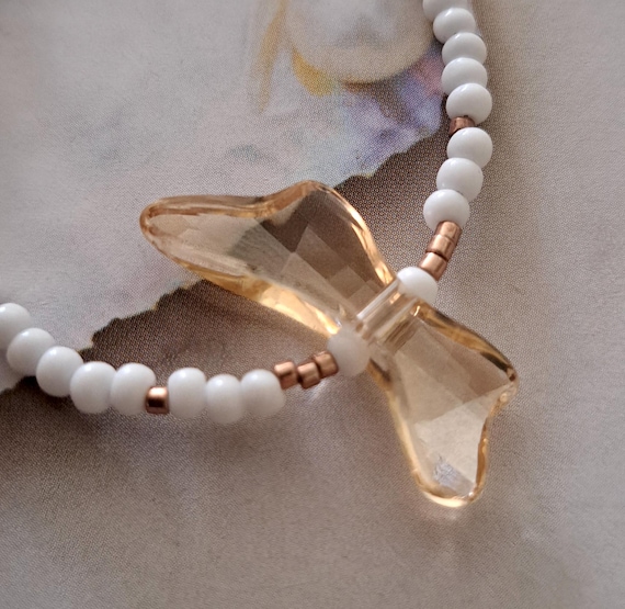 Swarovski crystal butterfly, choker style necklace, with seed beads and a magnetic clasp...x