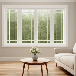 May include: A light and spacious living room with a neutral colour scheme. It features a cream-coloured sofa, a round wooden coffee table, and a large window with a view of trees. The room has hardwood floors and a white door.