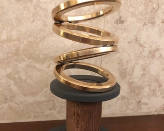 Escultura cinética de anillos giratorios - Grande'