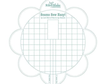 May include: A white printable sewing guide with a flower shape and a grid pattern. The guide is titled "Seams Sew Easy!" by Lori Holt of Bee in my Bonnet. It includes seam lines marked with 1/4 inch and 1/2 inch.