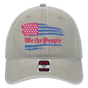 May include: A gray cotton baseball cap with a distressed American flag and the text "We the People" embroidered on the front. The cap has a relaxed fit and is labeled "Otto Dad Hat".