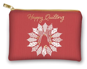 May include: Red zippered pouch with a gold zipper and the words "Happy Quilting" in gold script. The pouch features a white and red quilt design in the shape of a wreath.