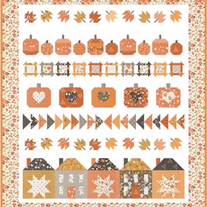 May include: A rectangular quilt featuring a white background with a floral border. The design includes rows of patterned fabric leaves, pumpkins, square blocks, heart-shaped pumpkin motifs, triangles, and five house blocks with star patterns.