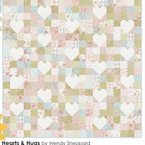 May include: A patchwork quilt with a repeating pattern of white hearts on a background of pastel squares. The squares feature floral and plaid designs in shades of pink, green, and blue. The text "Hearts & Hugs by Wendy Sheppard" is at the bottom.