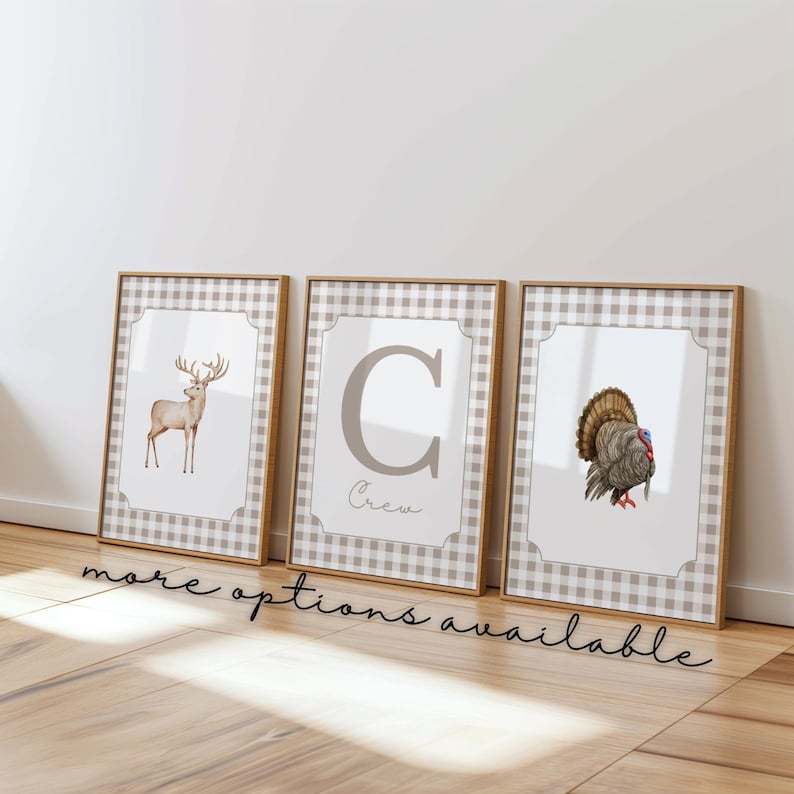 May include: Three framed prints with a gingham pattern border. The prints feature a deer, the letter C with the word "Crew" below it, and a turkey.