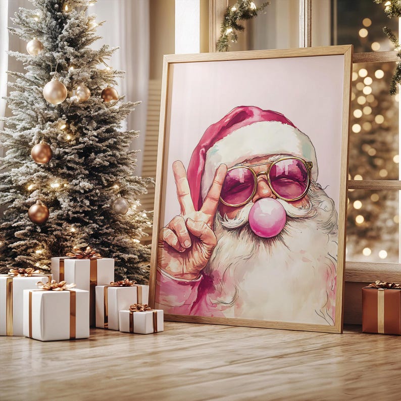 May include: A pink and white Santa Claus wearing sunglasses and blowing a bubble with a peace sign. The background is a light pink color.