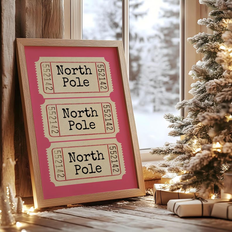 May include: A framed print with a pink background and three tickets with the text "North Pole" and the number "552142" on each ticket.