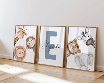 May include: Three framed art prints featuring watercolor illustrations of safari animals. The prints include a giraffe, monkey, lion, tiger, zebra, and elephant. The center print has the letter "E" and the name "Elijah".