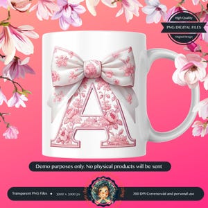 May include: A white ceramic mug with a pink floral design and a large pink bow. The letter "A" is in the center of the mug, surrounded by the floral design. The mug is on a pink background.