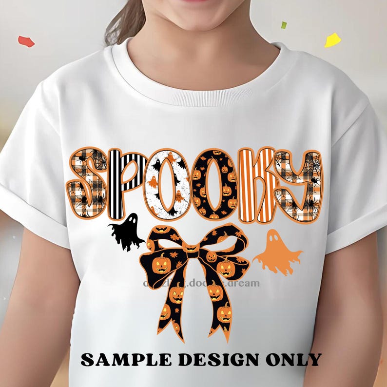 May include: White t-shirt with the word "SPOOKY" in orange, black, and white patterns, with a bow featuring pumpkin designs. Includes black and orange ghost graphics. The text "SAMPLE DESIGN ONLY" is at the bottom.