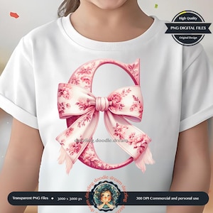 May include: A pink floral letter C with a large pink bow. The letter is surrounded by a white background.