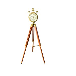 May include: A vintage floor clock with a round, gold clock face and Roman numerals. It stands on a wooden tripod with brass detailing. The clock's design has a classic, antique aesthetic, suitable for home decor. The clock's height is approximately 120 cm.
