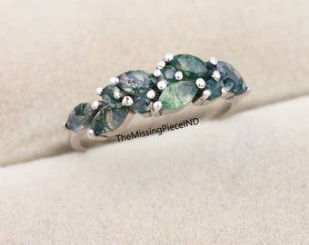 Anillo de compromiso de plata de ley con ágata musgosa marquesa y alianza de boda.