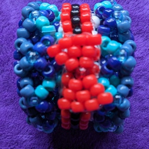 Vox inspired spinning Kandi cuff