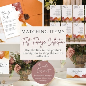 May include: Fall foliage wedding invitation suite with watercolor background in shades of orange, yellow, and red. The suite includes a wedding invitation, table numbers, and place cards. The text on the invitation reads "Kennedy & Curtis".