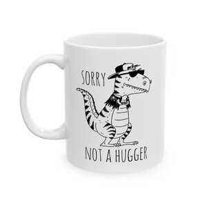 Funny T-Rex Mug - Not A Hugger Grumpy Dinosaur Gag Gift