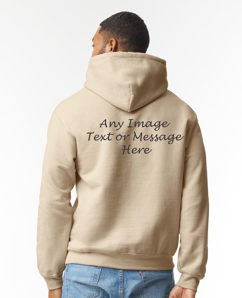 May include: A beige hoodie with a hood and a drawstring. The back of the hoodie has the text "Any Image Text or Message Here" printed in black.