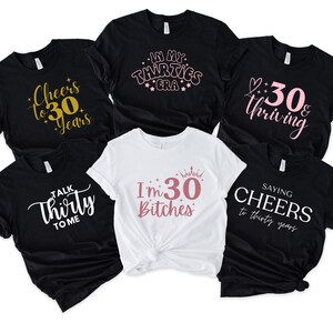 May include: Collection of black and white t-shirts with various phrases in different fonts. The phrases include "Cheers to 30 Years", "In My Thirties Era", "30 & Thriving", "Talk Thirty to Me", "I'm 30 Bitches", and "Saying Cheers to thirty years".