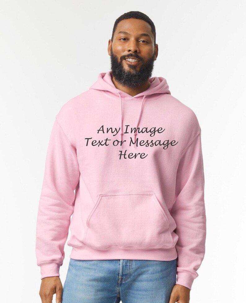 May include: A pink hoodie with a drawstring hood and a kangaroo pocket. The hoodie has the text "Any Image Text or Message Here" printed on the front.