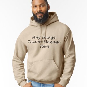 May include: A beige hooded sweatshirt with the text "Any Image Text or Message Here" printed on the front.