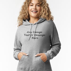 May include: A gray hooded sweatshirt with the text "Any Image Text or Message Here" printed on the front.