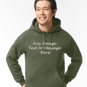 May include: A dark green hooded sweatshirt with a white pocket and the text "Any Image Text or Message Here" printed on the front.