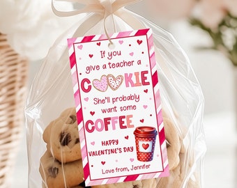 May include: A clear cellophane bag tied with a beige ribbon, filled with chocolate chip cookies. A Valentine's Day gift tag reads "If you give a teacher a cookie, she'll probably want some coffee." The tag has pink and red stripes and hearts.