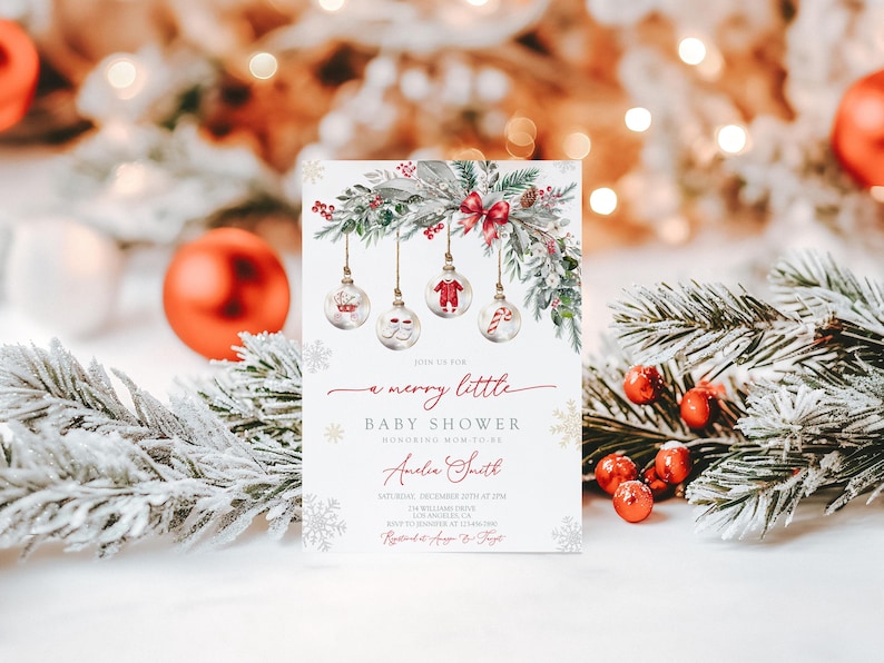 May include: A Christmas baby shower invitation with a festive design. The invitation has a white background with a decorative garland, baubles, and the text "a merry little baby shower". The invitation is for Amelia Smith.