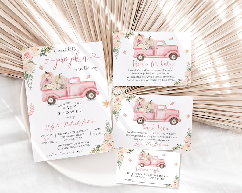 May include: A set of four printable cards for a baby shower. The cards feature a pink truck with pumpkins and fall foliage. The text on the cards reads "Sweet little pumpkin is on the way", "Books for baby", "Thank you", and "Diaper raffle".