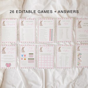 May include: A collection of eight baby shower game cards with a floral and bunny design. The cards have pink and white borders and include game titles like "Baby Word" and "How Big Is Her Stuff?" The text "26 Editable Games + Answers" is at the top.