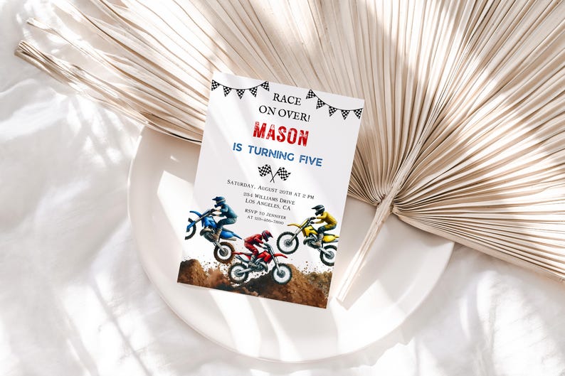 May include: A birthday party invitation with a motocross theme. The invitation is white with black and red checkered flags and the text "Race on Over! Mason is turning five." The invitation also includes a picture of three motocross bikes with riders in blue, red, and yellow racing suits.