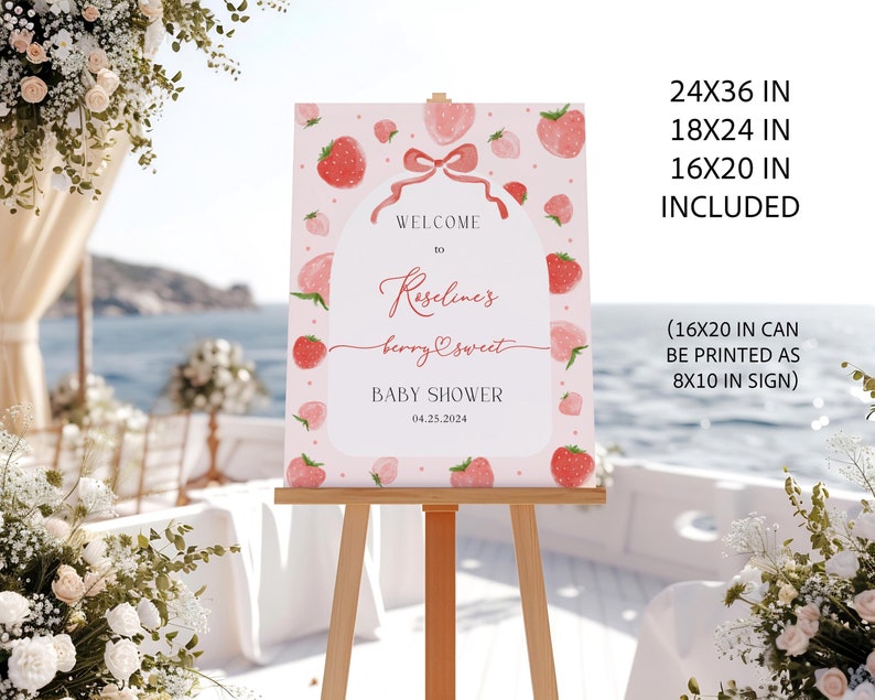 May include: A pink welcome sign with a strawberry theme for a baby shower. The sign says "Welcome to Riselines berry sweet Baby Shower 04.25.2024".