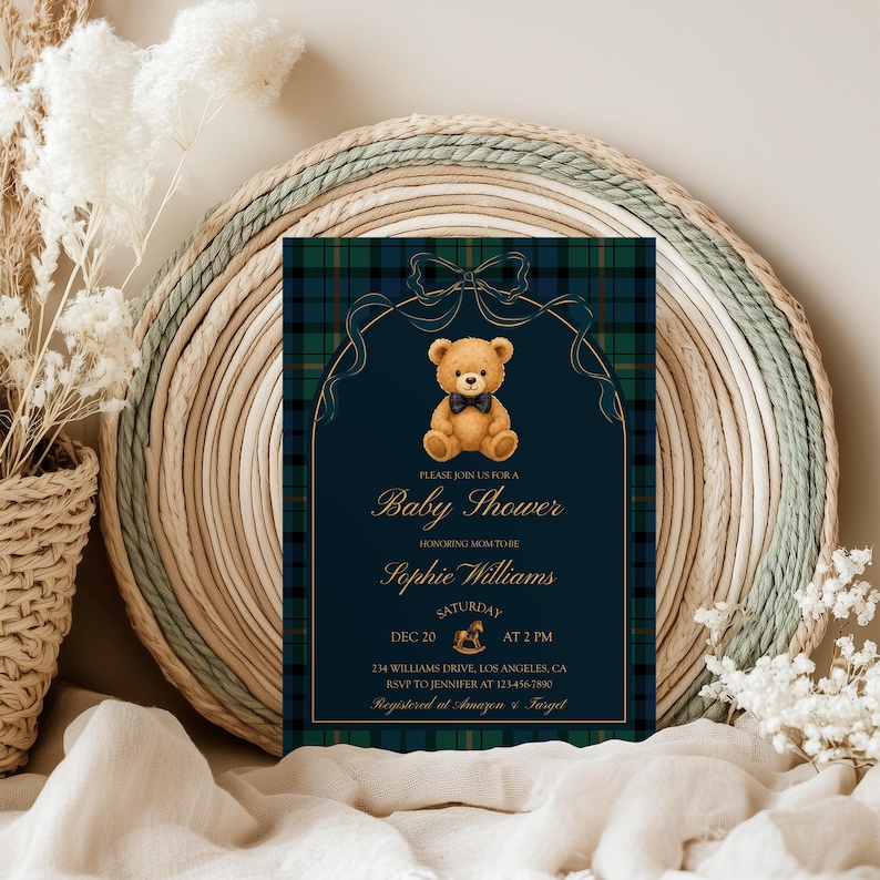 May include: Baby shower invitation with a navy blue and green plaid background. The invitation features a teddy bear illustration and gold text that reads "Baby Shower" and the honoree's name. The date and time are also included.