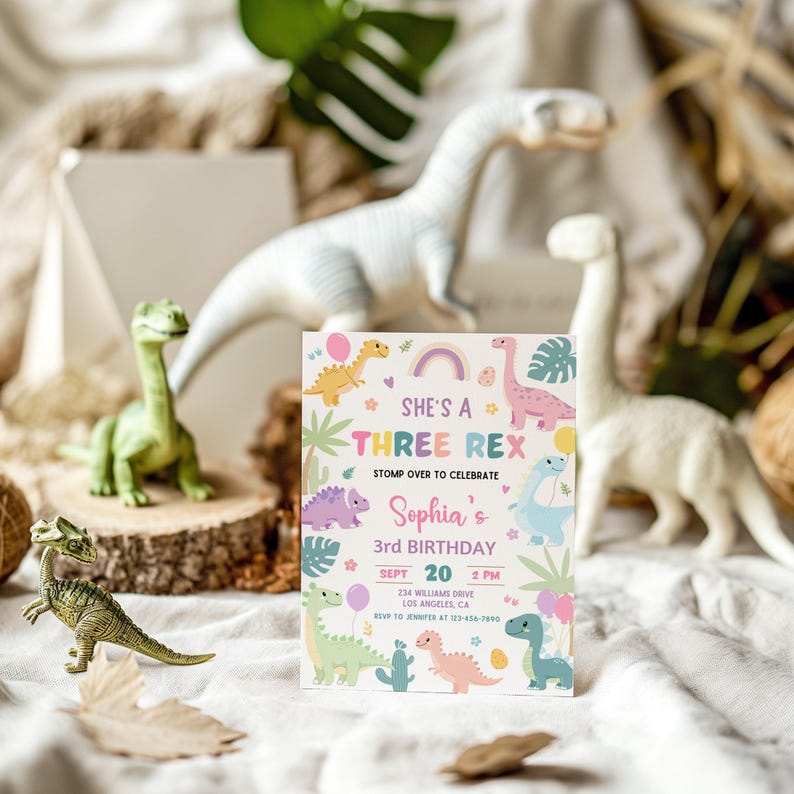 May include: A pink and green dinosaur-themed birthday invitation for a girl's third birthday party. The invitation says "She's a Three Rex" and includes a rainbow, eggs, and a variety of dinosaurs. The invitation includes the date, time, and location of the party.