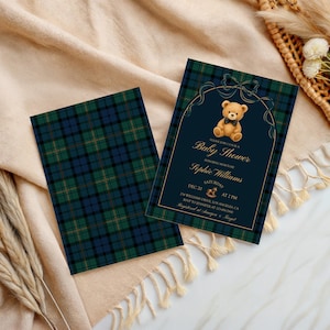 May include: Baby shower invitations with a navy blue and gold design. The invitation features a teddy bear illustration and the words "Baby Shower" and event details. The invitations have a plaid pattern on the back.