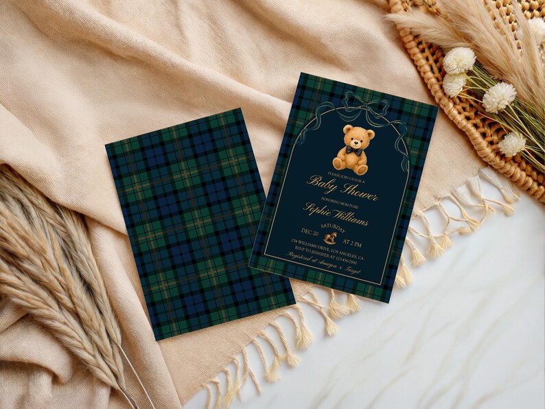 May include: Baby shower invitations with a navy blue and gold design. The invitation features a teddy bear illustration and the words "Baby Shower" and event details. The invitations have a plaid pattern on the back.
