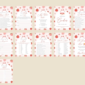 May include: A set of ten pink and white baby shower game cards with peach illustrations. The games include "Who Knows Baby Best", "Baby Animal Match", "Guess the Baby Food", "How Many Candies Are in the Jar", "Baby Word Scramble", "What's in the Diaper Bag", "Guess the Baby Food", "Baby Shower Bingo", "Guess the Baby's Due Date", and "The Pacifier Hunt".