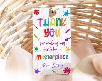 May include: Thank you for making my birthday a masterpiece. From: Sophia. A colorful thank you tag with paint splatters, paintbrushes, and a palette.