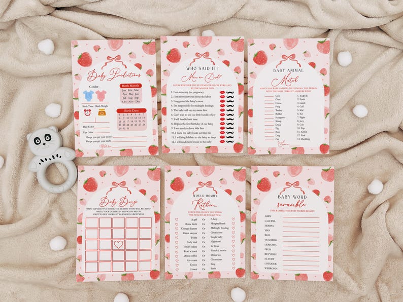 May include: Set of six pink and white baby shower game cards with strawberry and bow designs. The games include Baby Predictions, Who Said It, Baby Animal Match, Baby Bingo, Would Mommy Rather, and Baby Word Scramble.