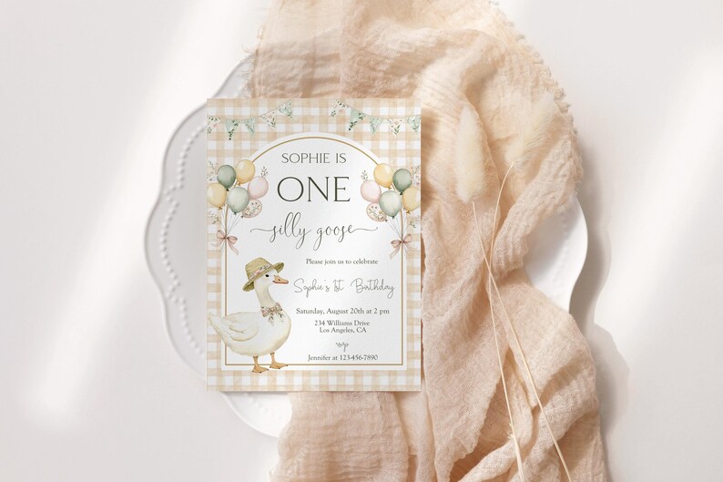May include: A light brown and white gingham patterned invitation with a white goose wearing a brown hat and a pink bow. The invitation says "Sophie is One jelly goose" and includes details for Sophie's 1st birthday party.