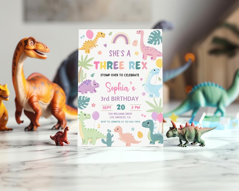 May include: A colourful invitation for a 3rd birthday party with a dinosaur theme. The invitation features a rainbow, a pink dinosaur, and the text "She's a Three Rex".