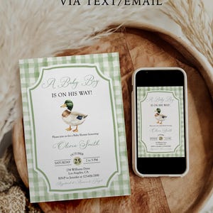 May include: Baby shower invitation with a green gingham border and the text "A Baby Boy Is On His Way!". Includes a watercolor duck illustration. A smartphone displays the same design. The invitation reads "Olivia Smith" and the date.
