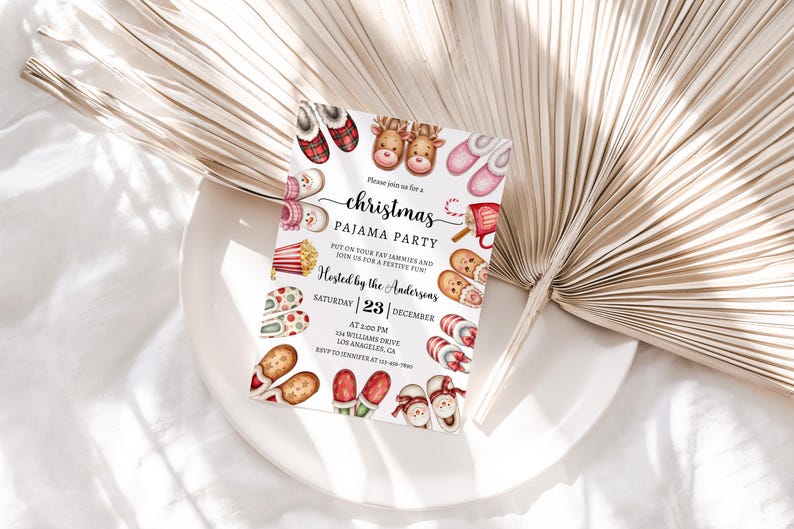 May include: A Christmas pyjama party invitation with a white background and colourful illustrations of slippers, popcorn, hot chocolate, and a snowman. The text reads "Please join us for a Christmas Pyjama Party. Put on your favourite jammies and join us for a festive fun! Hosted by the Andersons. Saturday | 23 | December. At 2:00 PM. 64 Williams Drive. Los Angeles, CA."