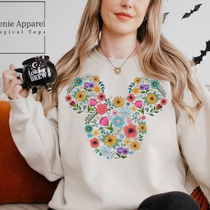 a woman sitting on a couch holding a camera