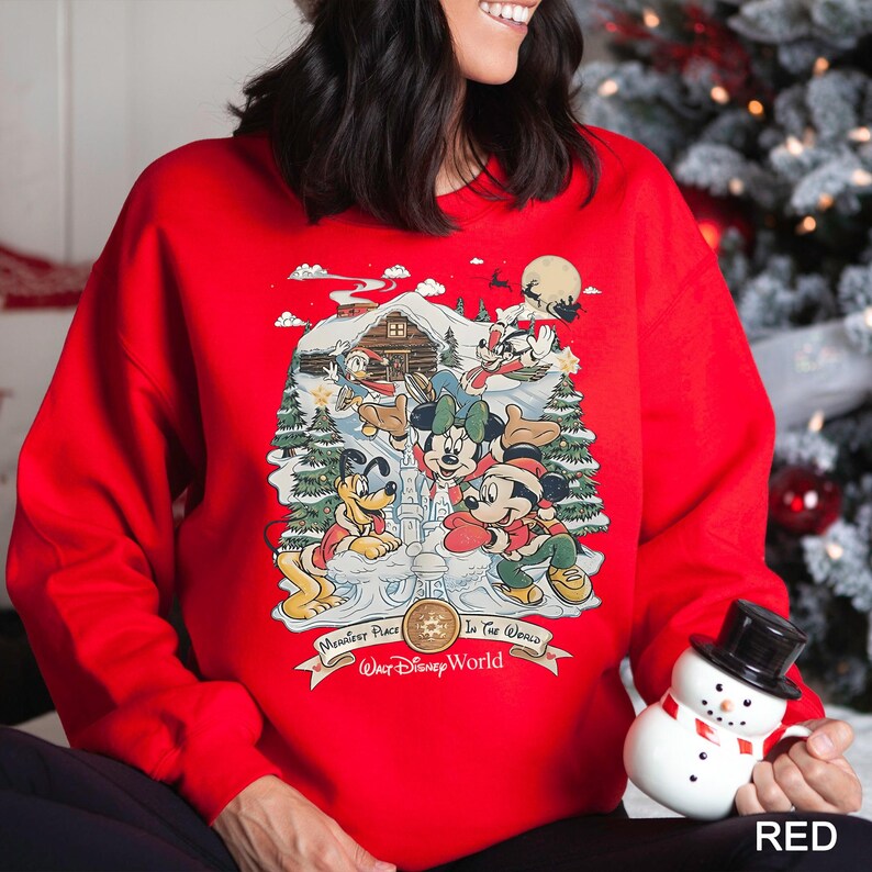 a woman wearing a mickey mouse christmas sweater