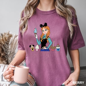 a woman is holding a cup of coffee