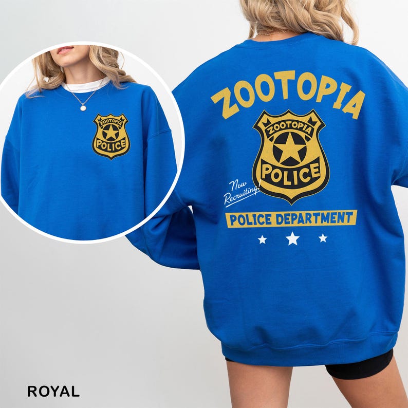 A woman wearing a blue sweatshirt with the text "Zootopia Police Department" printed on it.