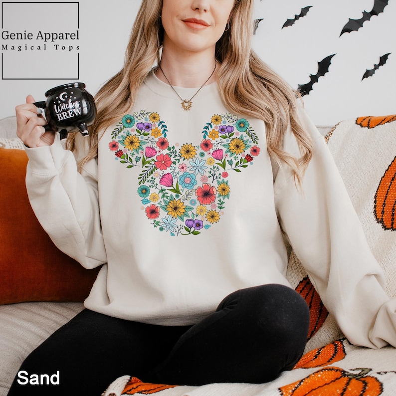 a woman sitting on a couch holding a camera