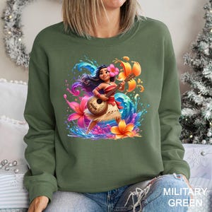 a woman wearing a sweatshirt with a cartoon character on it